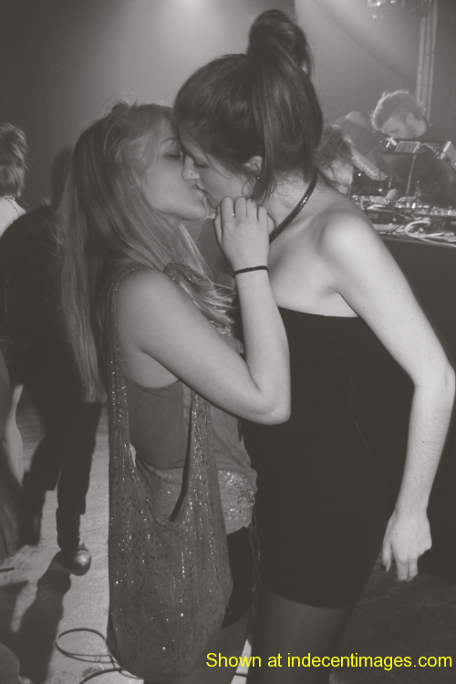 Teenage girls kissing