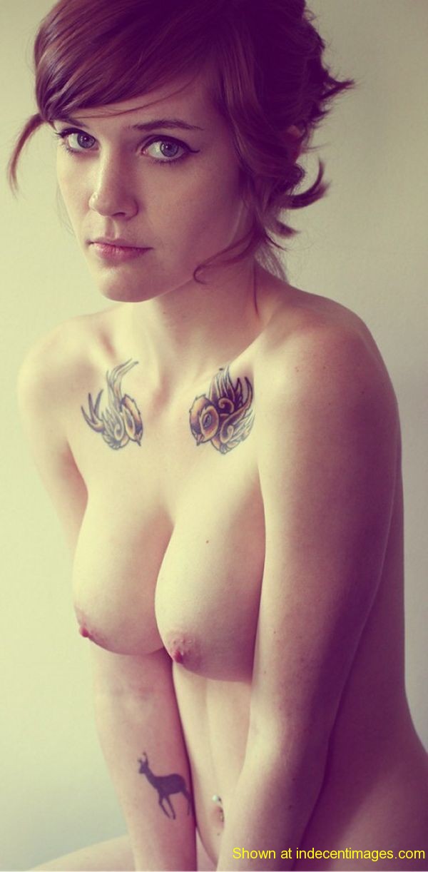 Naked girl with tats!