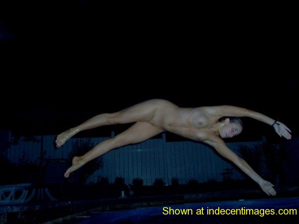 Girl dives into the pool naked