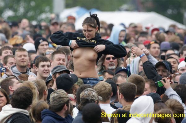 Girl flashes her boobs at a music concert