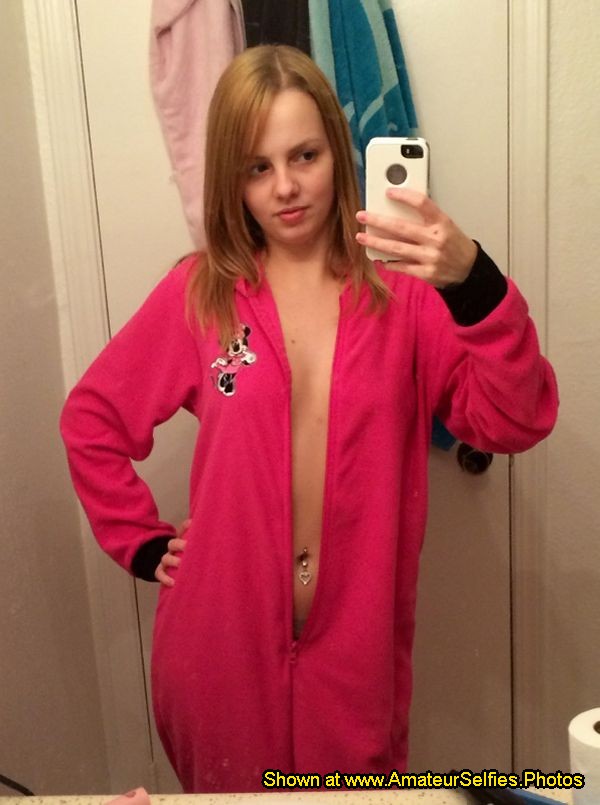Her selfie while wearing an unzipped onesie