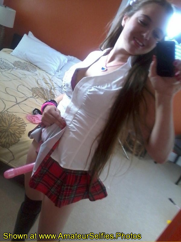 Schoolgirl with a strap-on