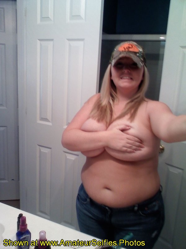 Chubby girl holds up her tits